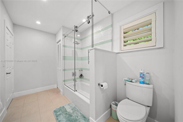 full bath with tile patterned flooring, baseboards, toilet, recessed lighting, and enclosed tub / shower combo