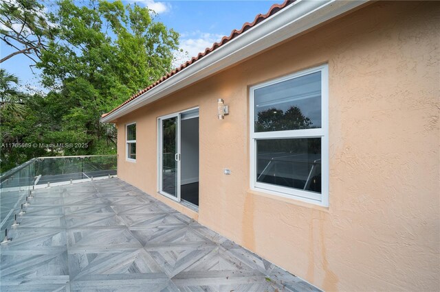 view of patio featuring a balcony