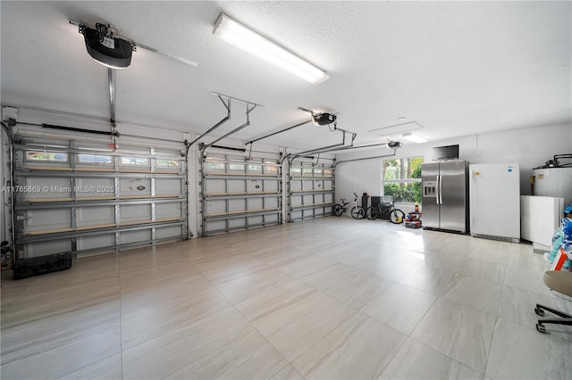garage with water heater, a garage door opener, freestanding refrigerator, and stainless steel refrigerator with ice dispenser