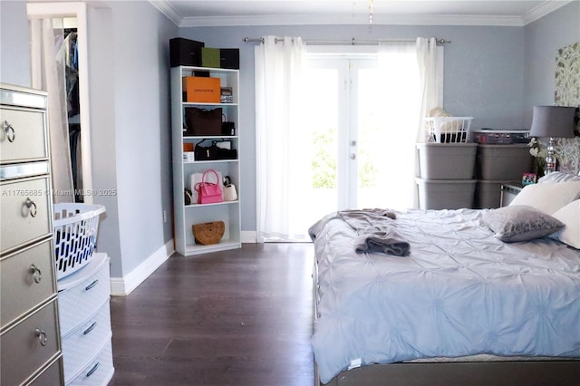 bedroom featuring access to exterior, crown molding, baseboards, and wood finished floors