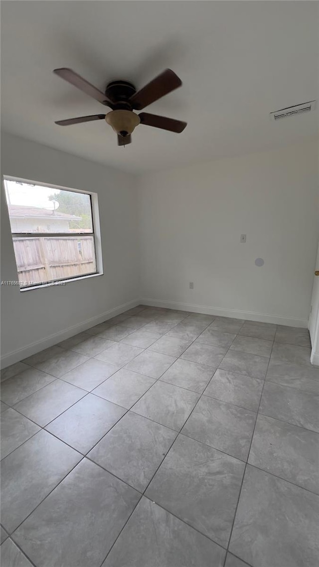 607 N 19th St, Fort Pierce, FL 34950 - spare room with visible vents, baseboards, ceiling fan, and light tile patterned flooring