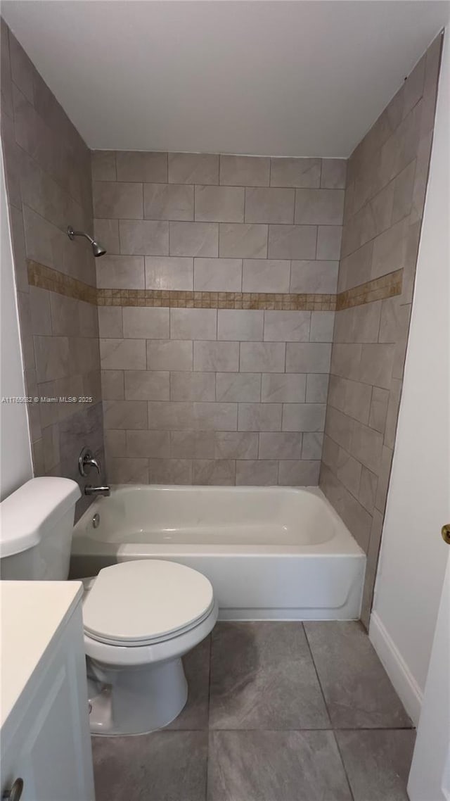 607 N 19th St, Fort Pierce, FL 34950 - bathroom featuring tile patterned flooring, baseboards, toilet, vanity, and  shower combination