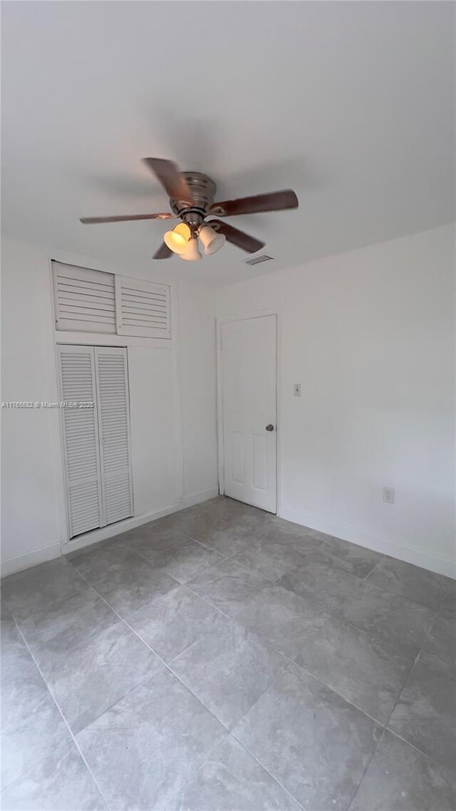 607 N 19th St, Fort Pierce, FL 34950 - spare room with baseboards, visible vents, and ceiling fan