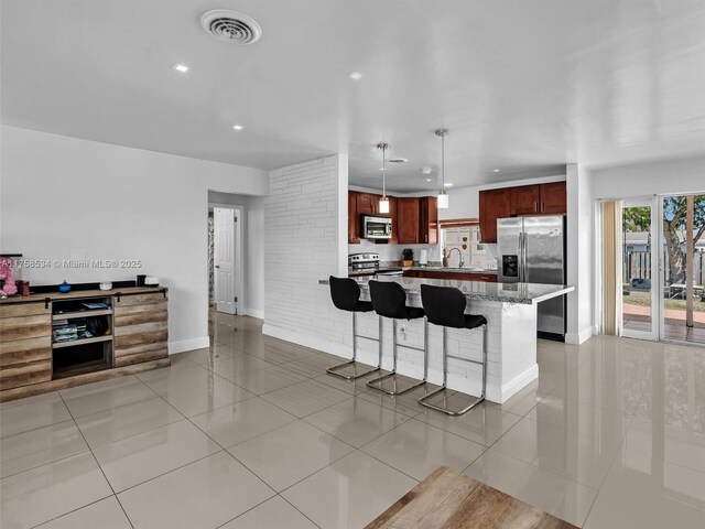 4401 Johnson St, Hollywood, FL 33021 - kitchen with light tile patterned floors, stainless steel appliances, and a sink
