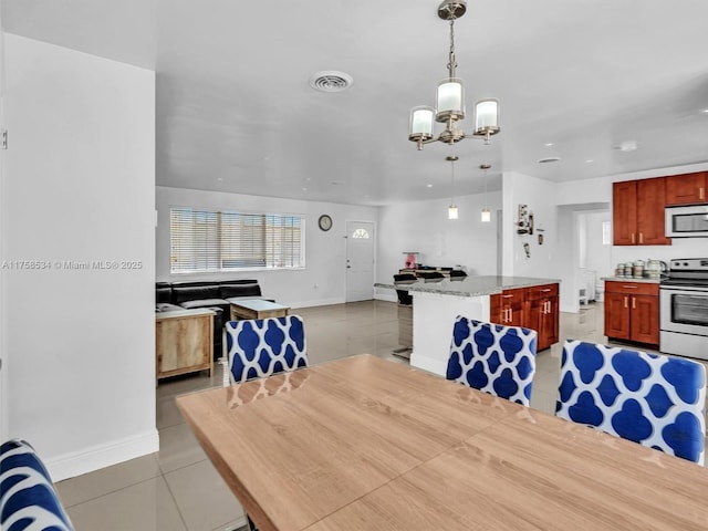 4401 Johnson St, Hollywood, FL 33021 - dining room featuring a notable chandelier, light tile patterned flooring, baseboards, and visible vents