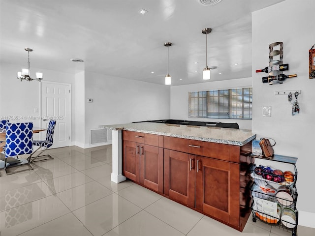 4401 Johnson St, Hollywood, FL 33021 - kitchen featuring light tile patterned floors, light stone countertops, visible vents, decorative light fixtures, and a notable chandelier