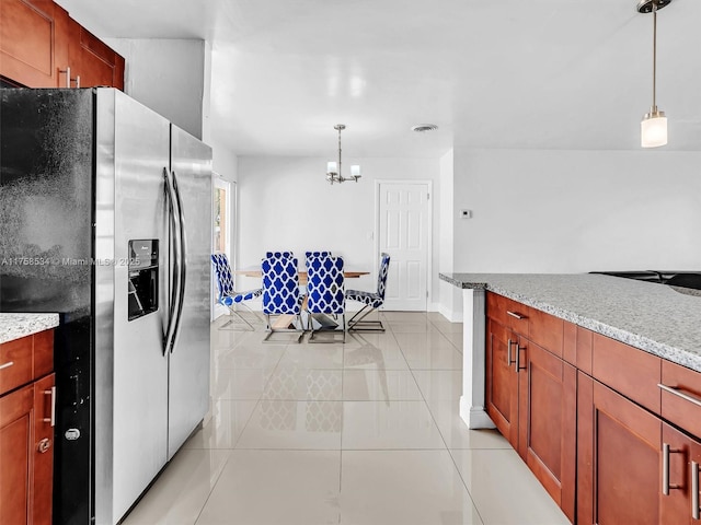 4401 Johnson St, Hollywood, FL 33021 - kitchen with a notable chandelier, decorative light fixtures, light tile patterned flooring, stainless steel fridge with ice dispenser, and light stone countertops