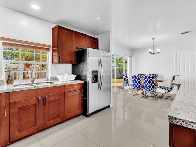 4401 Johnson St, Hollywood, FL 33021 - kitchen with light tile patterned floors, visible vents, a sink, stainless steel refrigerator with ice dispenser, and a notable chandelier