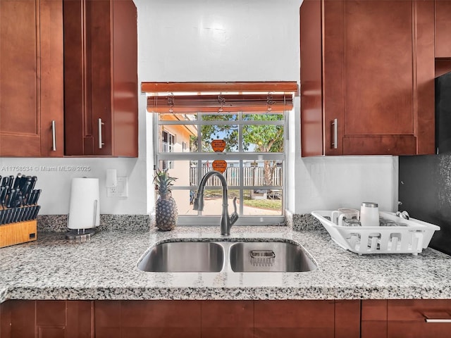 4401 Johnson St, Hollywood, FL 33021 - kitchen with a sink and light stone countertops