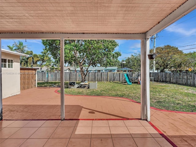 4401 Johnson St, Hollywood, FL 33021 - view of patio with a playground and a fenced backyard