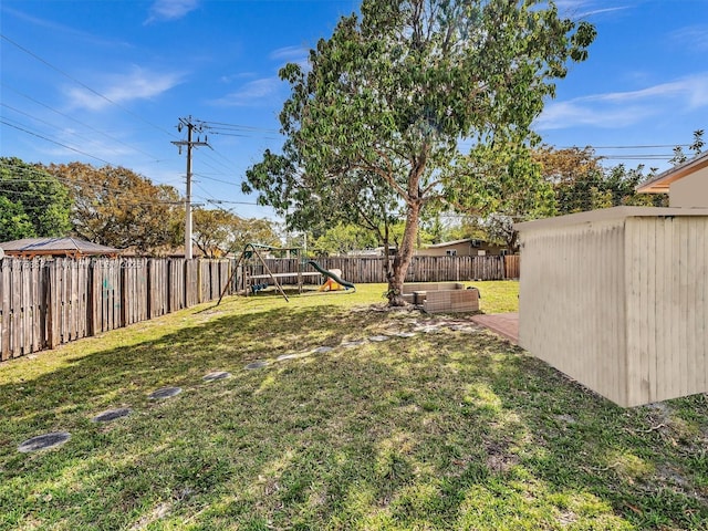 4401 Johnson St, Hollywood, FL 33021 - view of yard featuring a playground and a fenced backyard