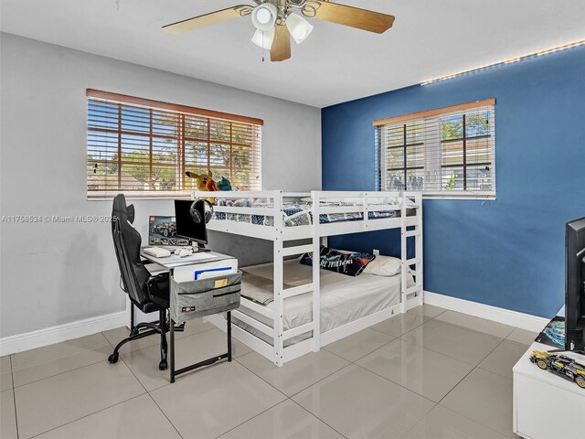 4401 Johnson St, Hollywood, FL 33021 - bedroom featuring tile patterned floors, a ceiling fan, and baseboards