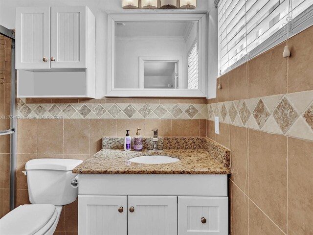 4401 Johnson St, Hollywood, FL 33021 - bathroom with toilet, tile walls, and vanity