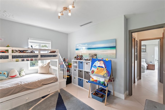 bedroom featuring tile patterned floors and visible vents