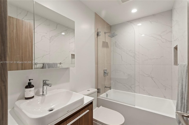 bathroom featuring toilet, vanity, shower / bathtub combination, and recessed lighting