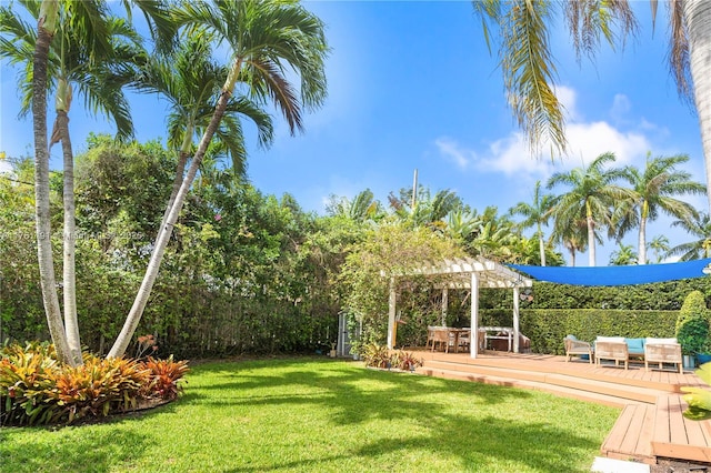 view of yard with a pergola and a wooden deck