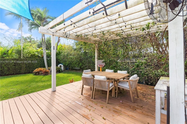 deck with a lawn, outdoor dining area, and a pergola