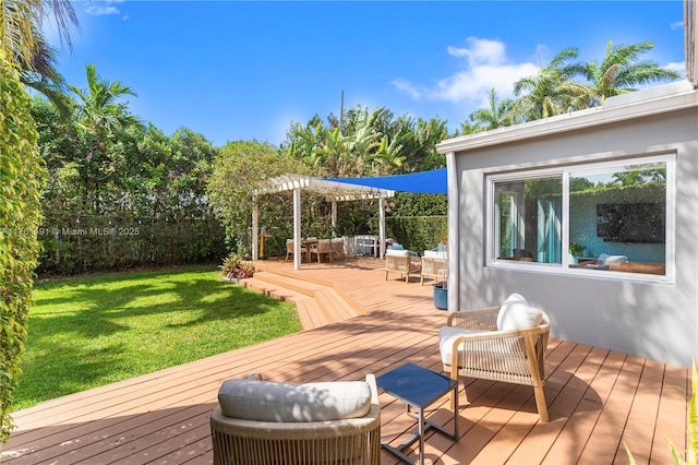 deck with a pergola, fence, and a yard