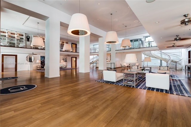 living area featuring ceiling fan and wood finished floors