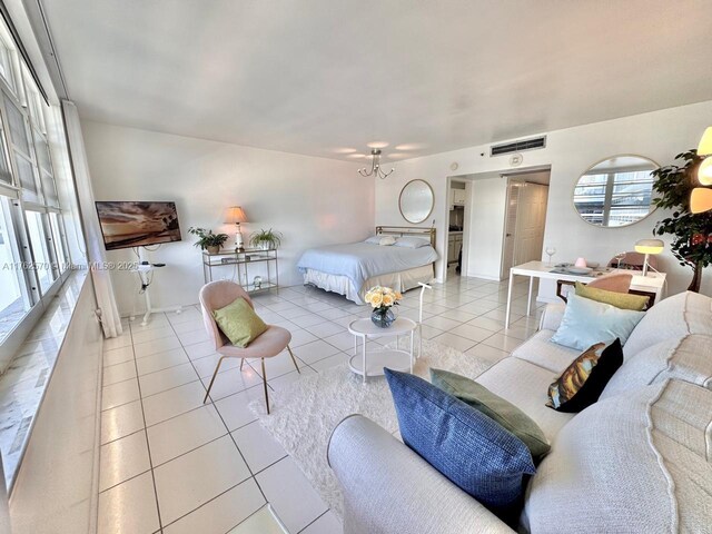 100 Lincoln Rd Unit 1231, Miami Beach, FL 33139 - tiled bedroom featuring baseboards