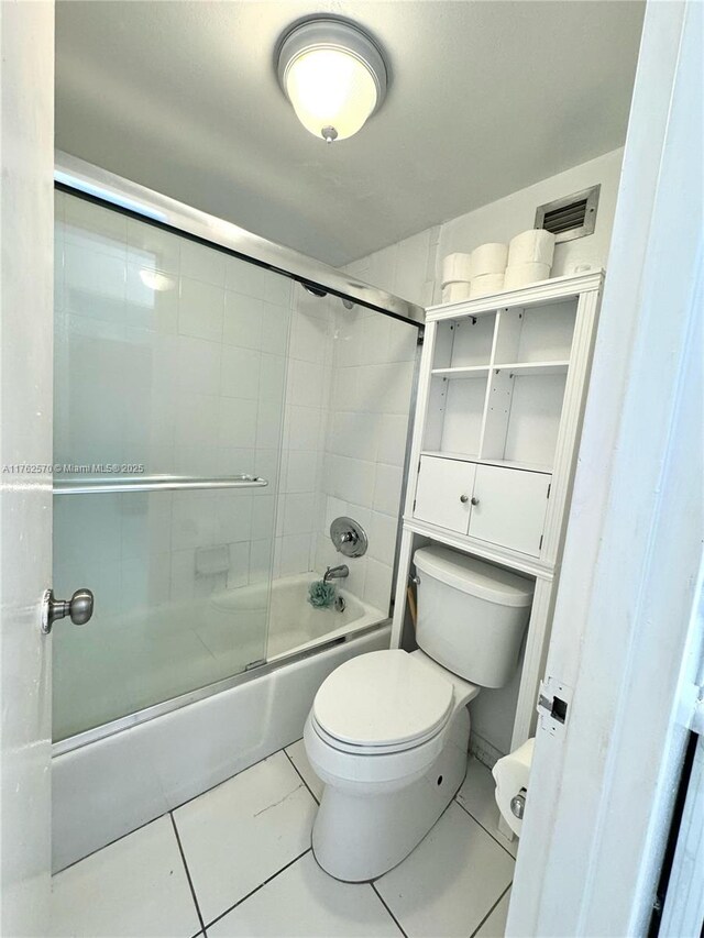 100 Lincoln Rd Unit 1231, Miami Beach, FL 33139 - full bath with toilet, tile patterned flooring, and shower / bath combination with glass door