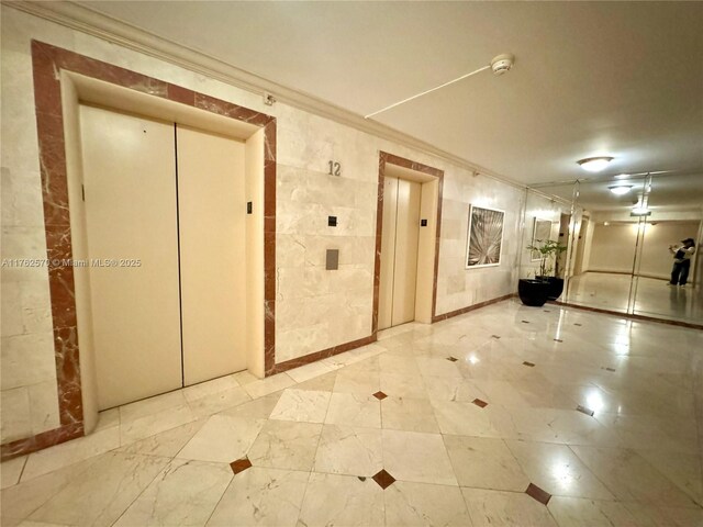 100 Lincoln Rd Unit 1231, Miami Beach, FL 33139 - hallway featuring elevator and ornamental molding