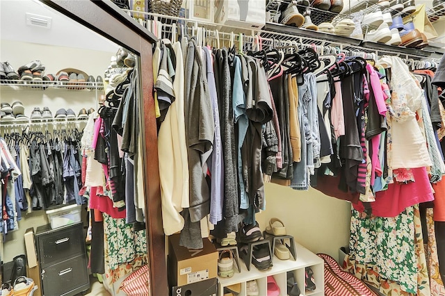 spacious closet featuring visible vents