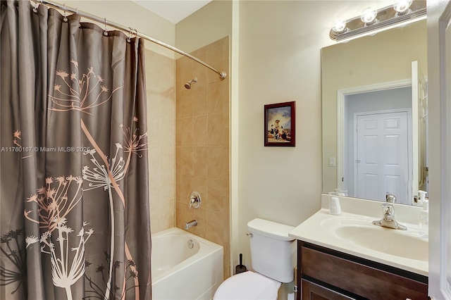 bathroom featuring toilet, shower / tub combo with curtain, and vanity