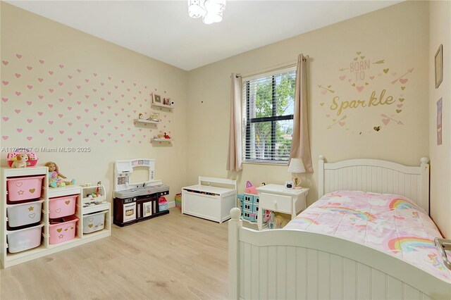bedroom with light wood-type flooring