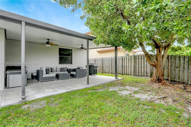 view of yard featuring a patio area, ceiling fan, outdoor lounge area, and fence