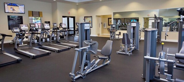 23906 SW 116th Ct, Homestead, FL 33032 - workout area featuring baseboards and a towering ceiling