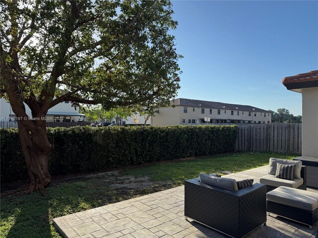 23906 SW 116th Ct, Homestead, FL 33032 - fenced backyard with a patio area and outdoor lounge area