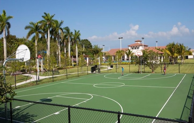 view of sport court featuring community basketball court and fence