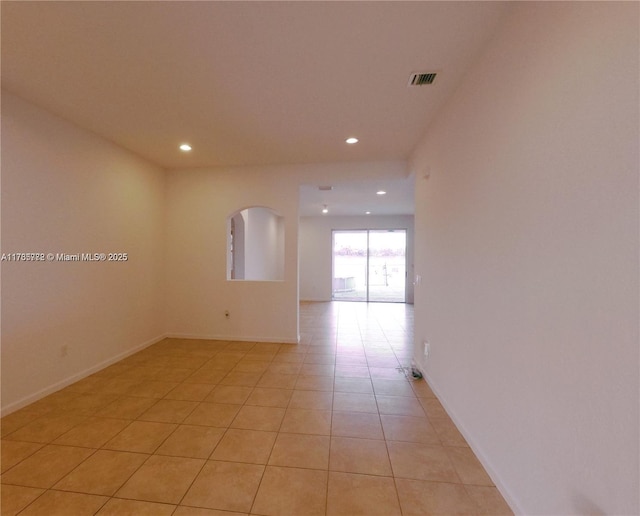 spare room featuring recessed lighting, visible vents, baseboards, and light tile patterned flooring