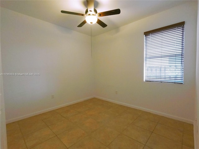 unfurnished room featuring light tile patterned floors, a ceiling fan, and baseboards