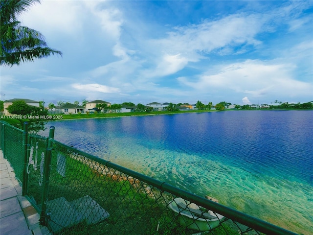 view of water feature with fence