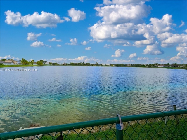 view of water feature with fence