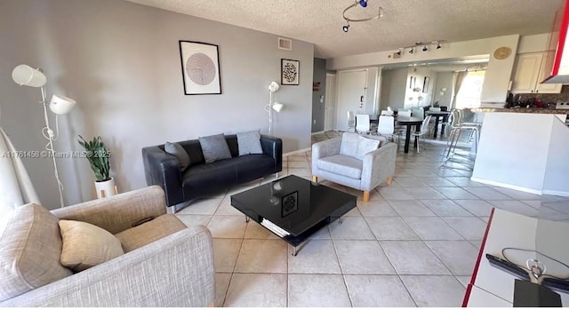 19555 E Country Club Dr Unit 8507, Aventura, FL 33180 - living area with light tile patterned floors, visible vents, and a textured ceiling