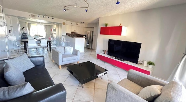 19555 E Country Club Dr Unit 8507, Aventura, FL 33180 - living room with rail lighting, light tile patterned floors, visible vents, and a textured ceiling
