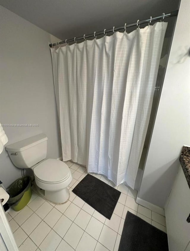 19555 E Country Club Dr Unit 8507, Aventura, FL 33180 - full bath featuring a shower with shower curtain, tile patterned floors, and toilet