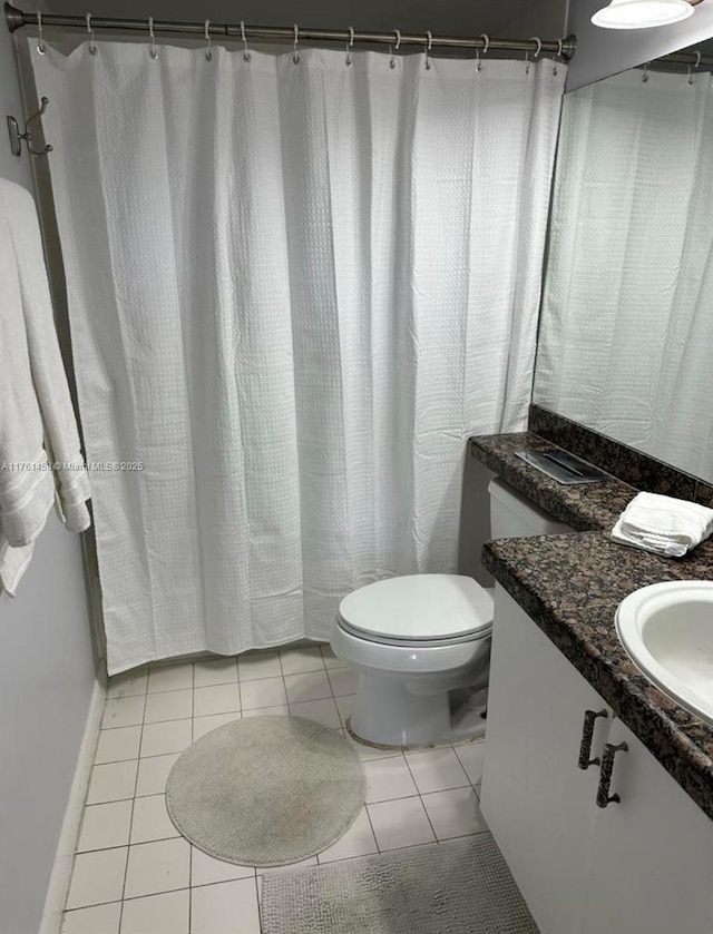 19555 E Country Club Dr Unit 8507, Aventura, FL 33180 - bathroom featuring tile patterned floors, toilet, vanity, and baseboards