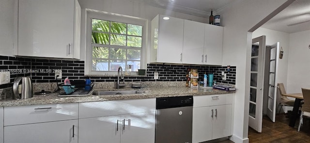kitchen with backsplash, dishwasher, dark wood-style floors, white cabinetry, and a sink