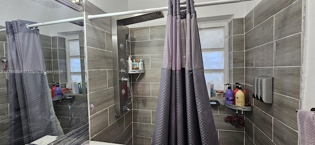 full bath with tiled shower