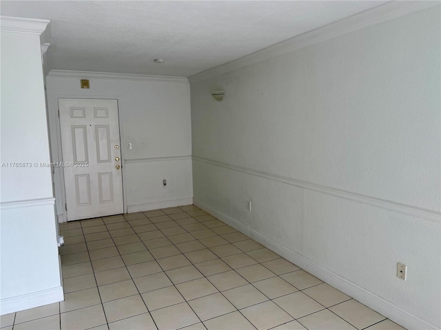 spare room with crown molding
