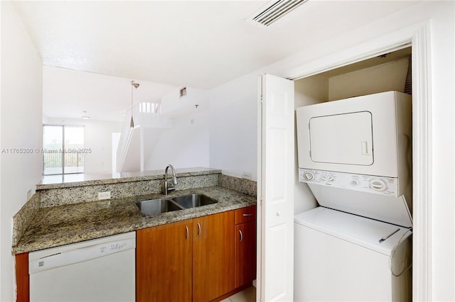 1650 Coral Way Unit Ph-9, Miami, FL 33145 - washroom featuring stacked washer / dryer