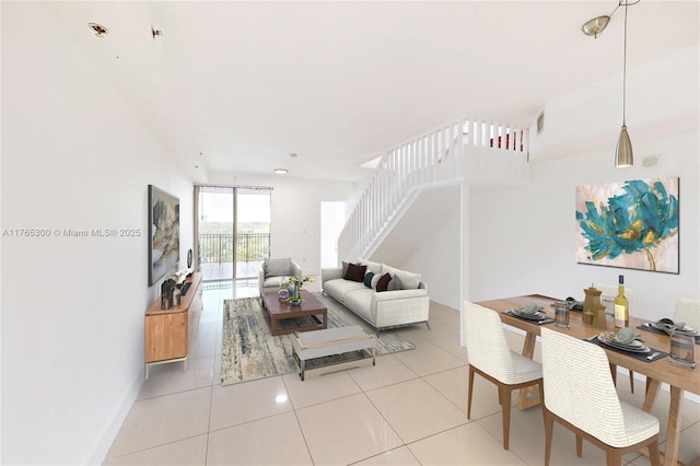 1650 Coral Way Unit Ph-9, Miami, FL 33145 - tiled living area featuring stairs and baseboards
