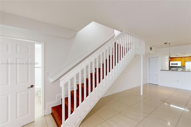 1650 Coral Way Unit Ph-9, Miami, FL 33145 - stairway with tile patterned flooring and baseboards