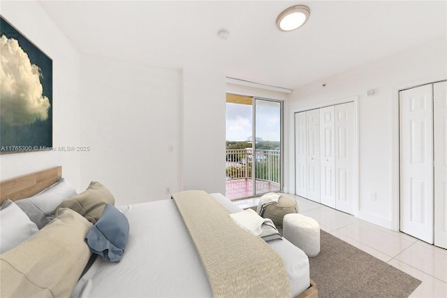 1650 Coral Way Unit Ph-9, Miami, FL 33145 - bedroom featuring access to outside, two closets, and tile patterned floors