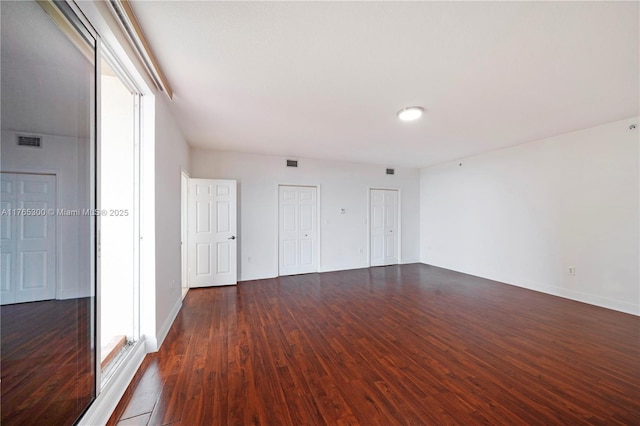 1650 Coral Way Unit Ph-9, Miami, FL 33145 - spare room featuring dark wood-type flooring and baseboards