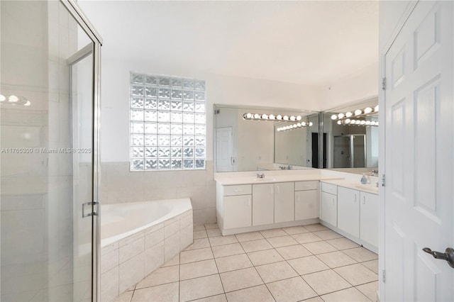 1650 Coral Way Unit Ph-9, Miami, FL 33145 - full bathroom with vanity, a shower stall, tile patterned floors, and a bath